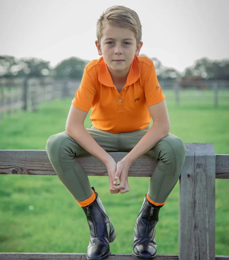 Premier Equine Cisco Junior Unisex Polo Shirt Orange